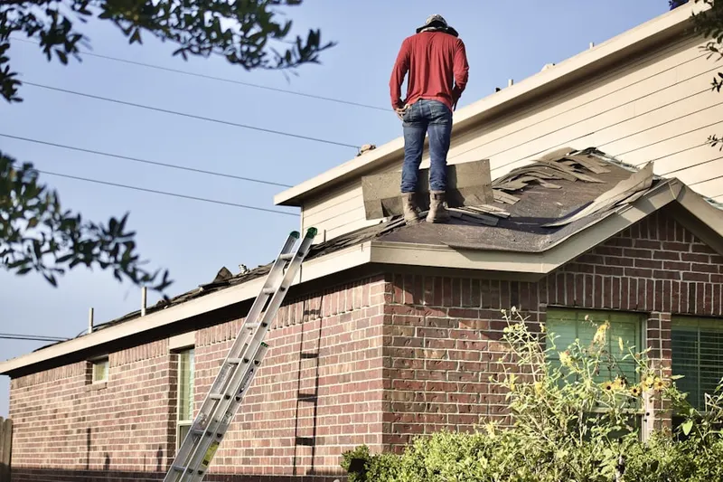 Professional roofer working on a residential roof in North Ridgeville